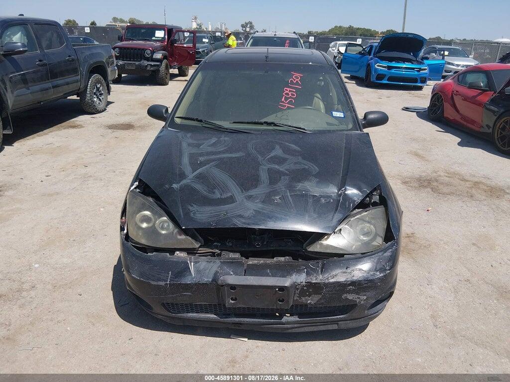 3FAFP37Z74R117937 2004 FORD FOCUS photo no. 11