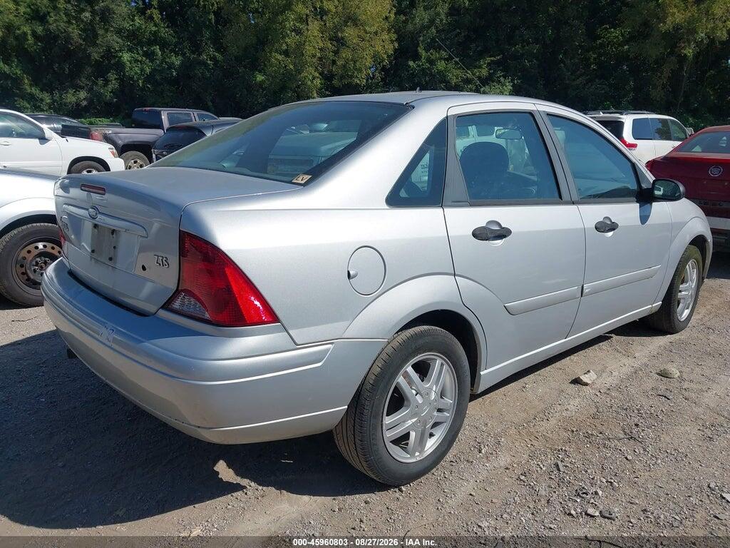 1FAFP38Z74W138556 2004 FORD FOCUS photo no. 4