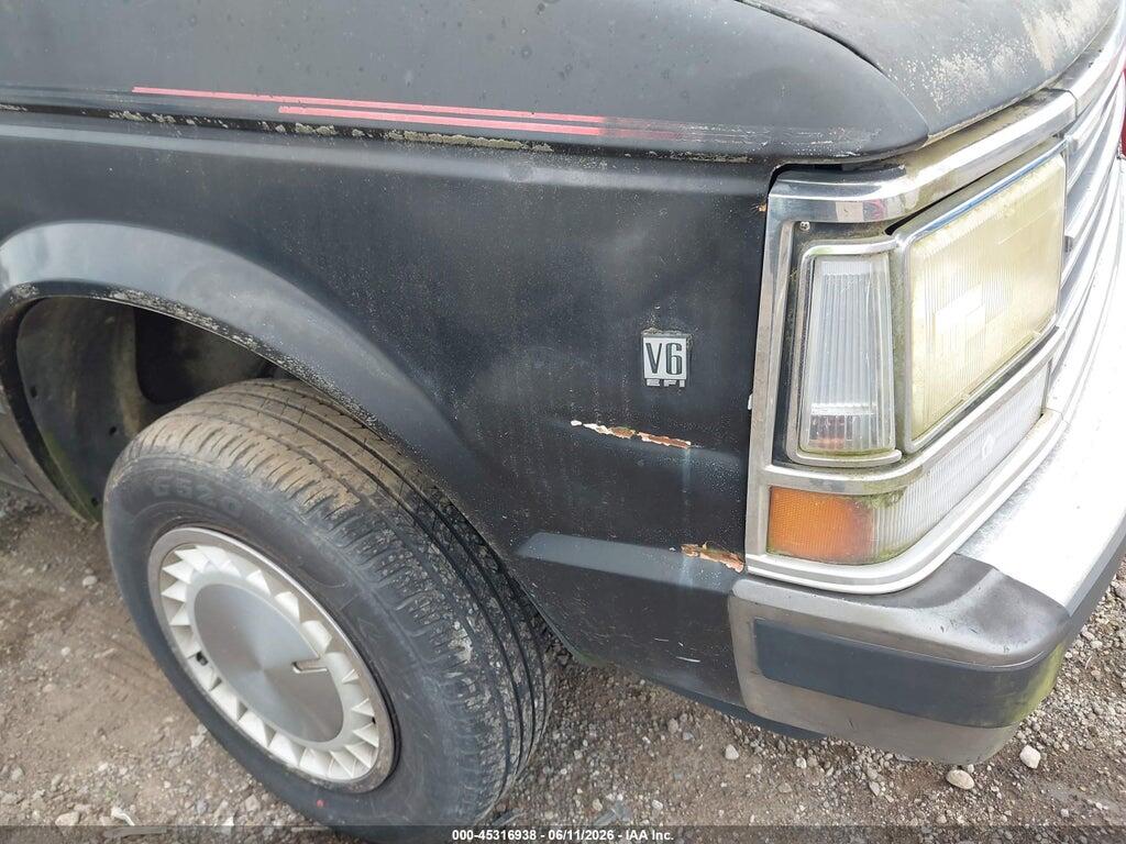 2P4FH4534LR561384 1990 PLYMOUTH VOYAGER photo no. 12