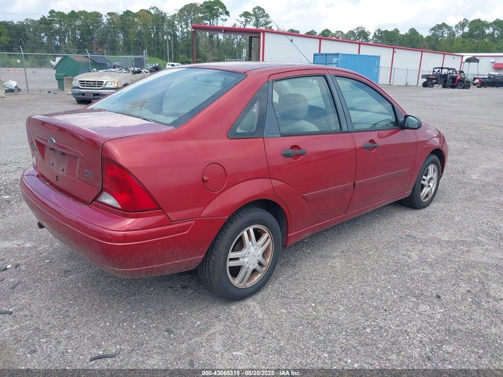 1FAFP38Z74W108697 2004 FORD FOCUS photo no. 4