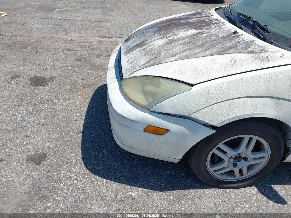 1FAFP3434YW125500 2000 FORD FOCUS photo no. 6